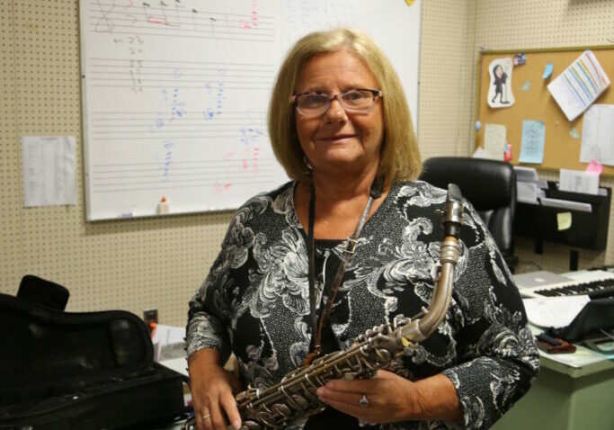 Camden County ESP of the Year Rose Casey poses with her cherished saxophone, which she plays with the band students.