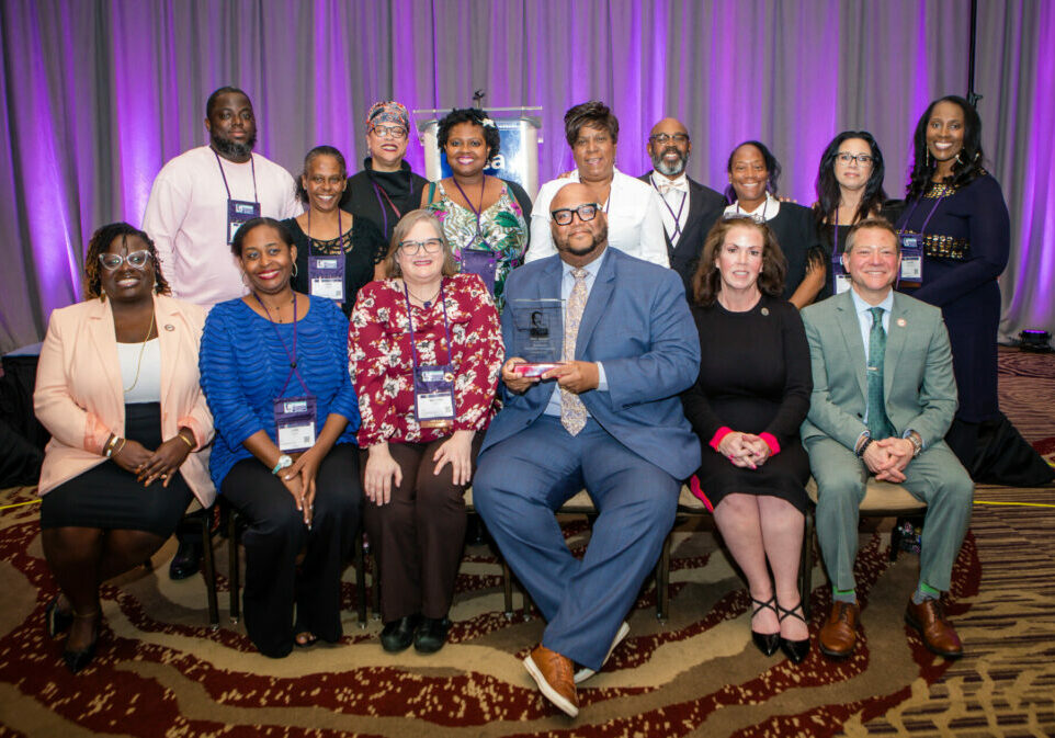 The Plainfield Education Association is this year’s winner of the Jim George Collective Bargaining Award. Seated, from left: NJEA Secretary-Treasurer Petal Robertson, PEA 2nd VP Lori Davis, PEA 1st VP Melissa Logan, PEA President Keith Coston, UniServ Field Rep Maryanne Rodriguez, NJEA VP Steve Beatty. Standing from left: PEA Negotiations Team members Andre Payton, Faye Clark, Nyla Glover, Keisha Gaye Peynado, Jodi Byers, Gregory Powell, Denise Taylor, Lori DiSarro and Karen Richards.