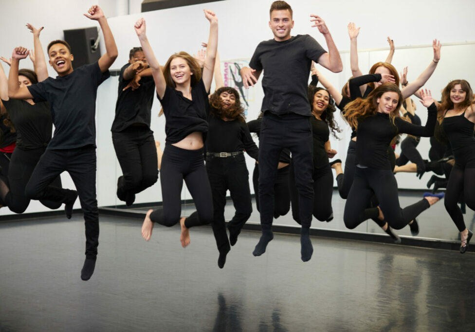 Male And Female Students At Performing Arts School Rehearsing Street Dance In Studio