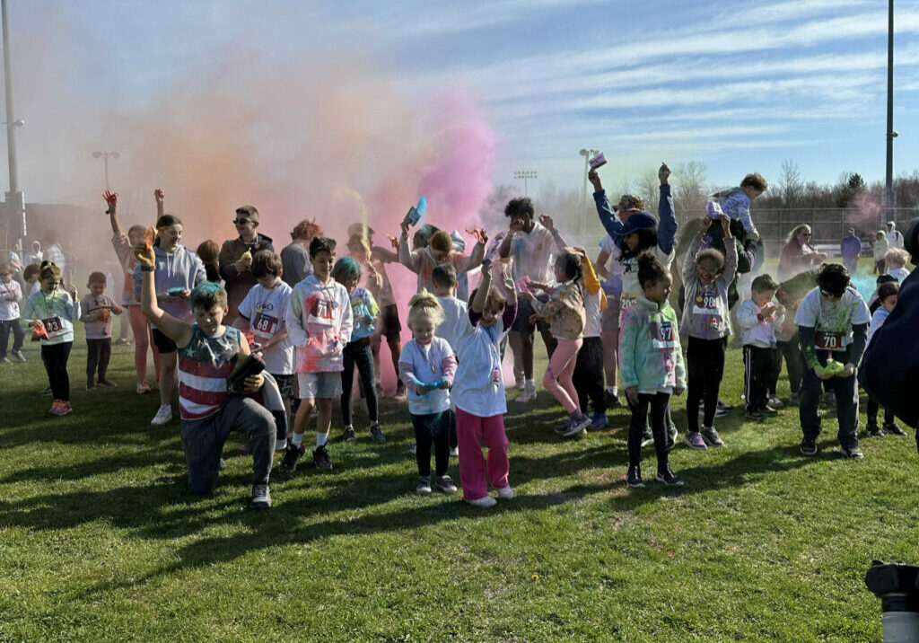 A spirited celebration at the end of the Color Run, marking the conclusion of a fun and successful day.