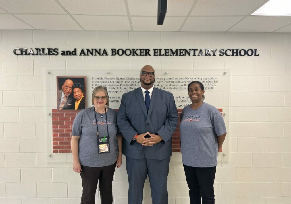 PEA First Vice President Melissa Logan, President Keith Coston and Second Vice President Lori Davis stand proud at Charles and Anna Booker Elementary School.