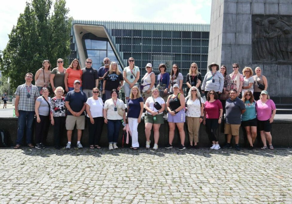 Each year, the Holocaust Education tour group quickly creates a deep connection. The 2023 tour group, pictured here, continues to hold reunions.